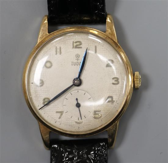 A gentlemans 9ct gold Tudor manual wing wrist watch, with subsidiary seconds, on later associated strap.